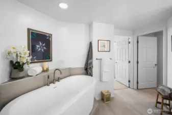 Primary bath featuring upgraded vanity and lighting.