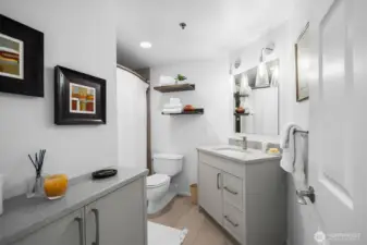 Remodeled full bath serving guest and secondary bedroom areas.