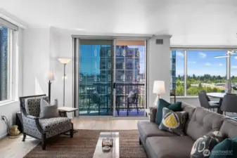 Natural light-filled living space overlooking Downtown Bellevue skyline.