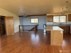 looking east in living room towards stairs and kitchen