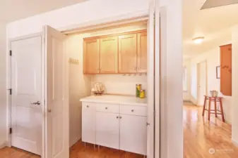 Extra pantry space, with entrance to garage alongside.