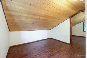 Another view of the bedroom looking out into the loft area.