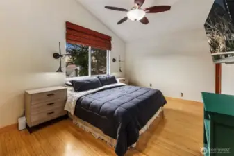 Primary bedroom suite with vaulted ceilings