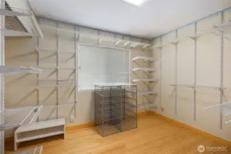 Primary bedroom walk in closet, so much space for all of your belongings!