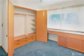 Bedroom 2, with built-in desk and closet storage