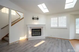A beautiful fireplace anchors the living area—ideal for Pacific Northwest comfort.