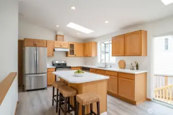 An inviting island kitchen awaits your cooking adventures - Virtual Staged