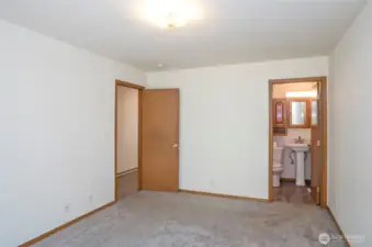 Primary suite offers added convenience with private full bath.