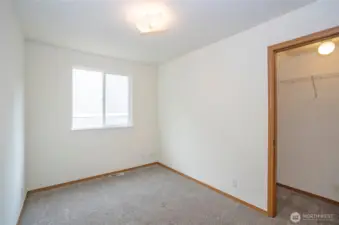 Guest suite #1 on the main level featuring a walk-in closet.