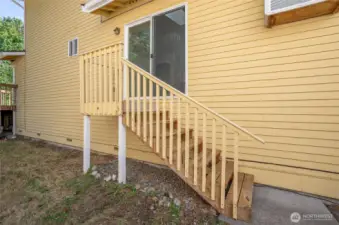 Dining area features stairway access to the backyard.