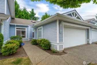 Stair-free single-story condo with vaulted ceilings and an open floor plan.