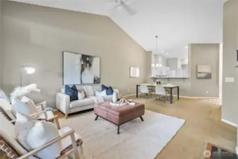 Bright open layout combining kitchen, dining, and living spaces.