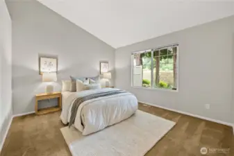 Spacious primary bedroom with plenty of room to relax and unwind.