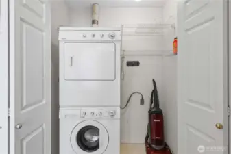 Efficient laundry setup with stackable washer and dryer to maximize space.
