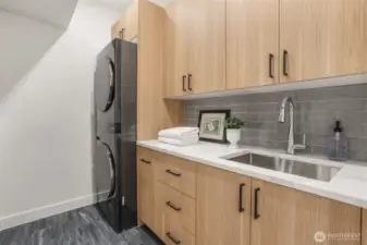 Convenient upstairs laundry with more storage.