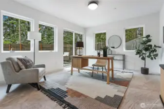 The fourth bedroom/office downstairs opens to a private patio.
