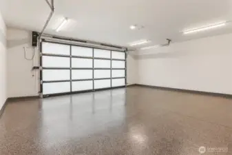 Spacious, clean garage has two electric charging outlets.