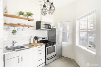 Ample window light makes this a great spot for many businesses, or a picture perfect vacation rental