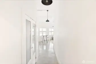 Hallway with spacious closet, which is laundry ready if desired