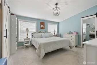 Primary bedroom- with the 3/4 bath to the right custom closet to the left.