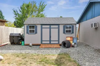 Cute Garden Shed tucked behind the garage.