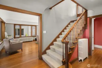 The entry showcases coved ceilings and stairs adorned with luxurious wool wall-to-wall carpeting.