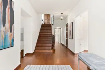 Entry with Siberian oak and rought iron  staircase