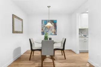 Dedicated dining room space with new vinyl plank flooring