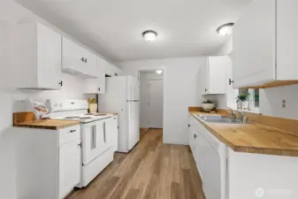 Kitchen that then leads to the utility room and attached garage.