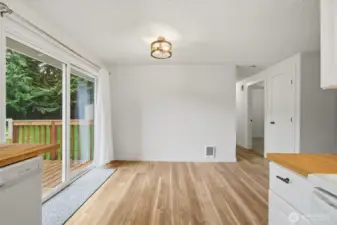 Sliding door leads to the fully fenced backyard off of the dining room.