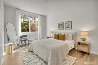 Primary suite offer ample room for bed and furniture and a large window provides plenty of natural light.