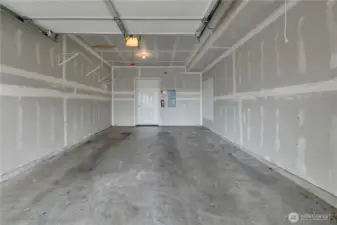 Garage door opener is installed for convenience.