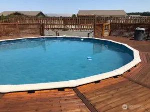 Above ground pool with deck.