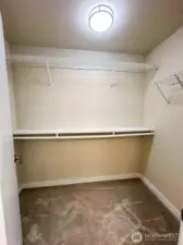 Roomy walk-in closet with shelves