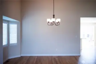 Dining Room with bay windows opens to kitchen.