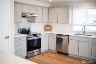 Big Kitchen with Stainless Appliances with NEW Quartz Countertops and lots of cabinets