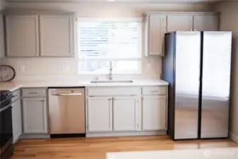 Sunny window over the kitchen sink & a brand new Stainless refrigerator