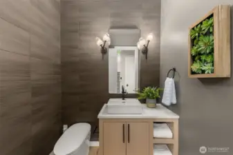 Designer powder room with smart toilet and full height tile walls