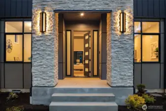 Covered front porch with extensive stonework