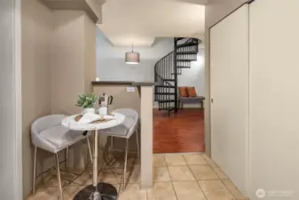 Kitchen opening up and flowing seamlessly into living space.