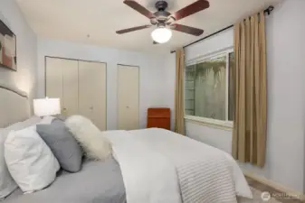 Large windows offering natural light to flow through upper bedroom space.