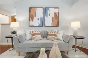 Spacious living room offering natural light streaming through from windows above.