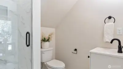 Photos for reference.  Same floorplan, similar features. 3/4 bath off lower level room has tile shower and flooring.