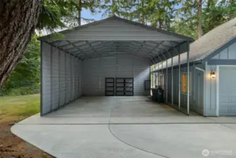 Covered RV parking with power and water hook-ups or room for toys!