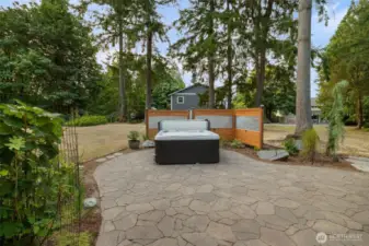 Stone patio with 8 person Jacuzzi Spa and plenty of room to BBQ and entertain.