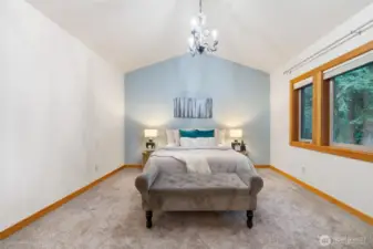 Primary bedroom sits just up a few stairs on the second level - completely separate from all other rooms!