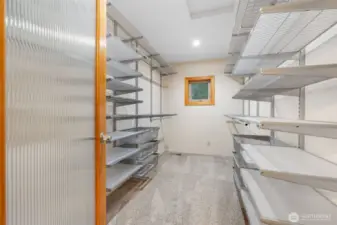 Custom organizers in this large primary closet.