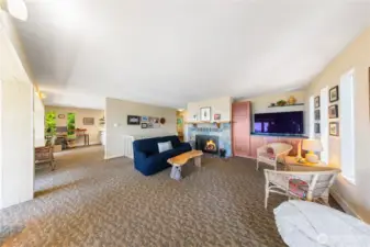A generous open floorplan so you can circulate to enjoy the view, and the cozy wood burning fireplace.