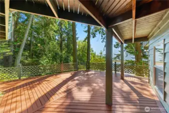 The lower level deck, bedroom #3 is to the right. There is also a door from this deck to the fully equipped workshop on the lower level.