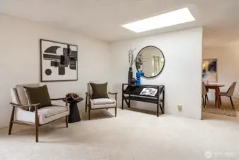 This living room hosts a lovely skylight for extra light.